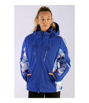 A woman weraing a blue insulated ski jacket with blue, pink, and white pattern accents, featuring a hood, zip pockets, and a snow skirt.
