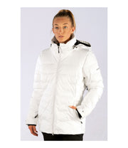 A woman wearing a white insulated puffer jacket featuring a hood, zip closure, and multiple pockets.