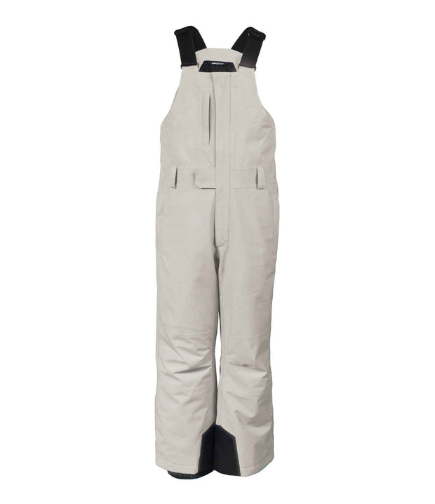 A pair of beige girls' bib pants with intergrated suspenders, a zippered chest pocket with a flap, hand pockets and belt loops.